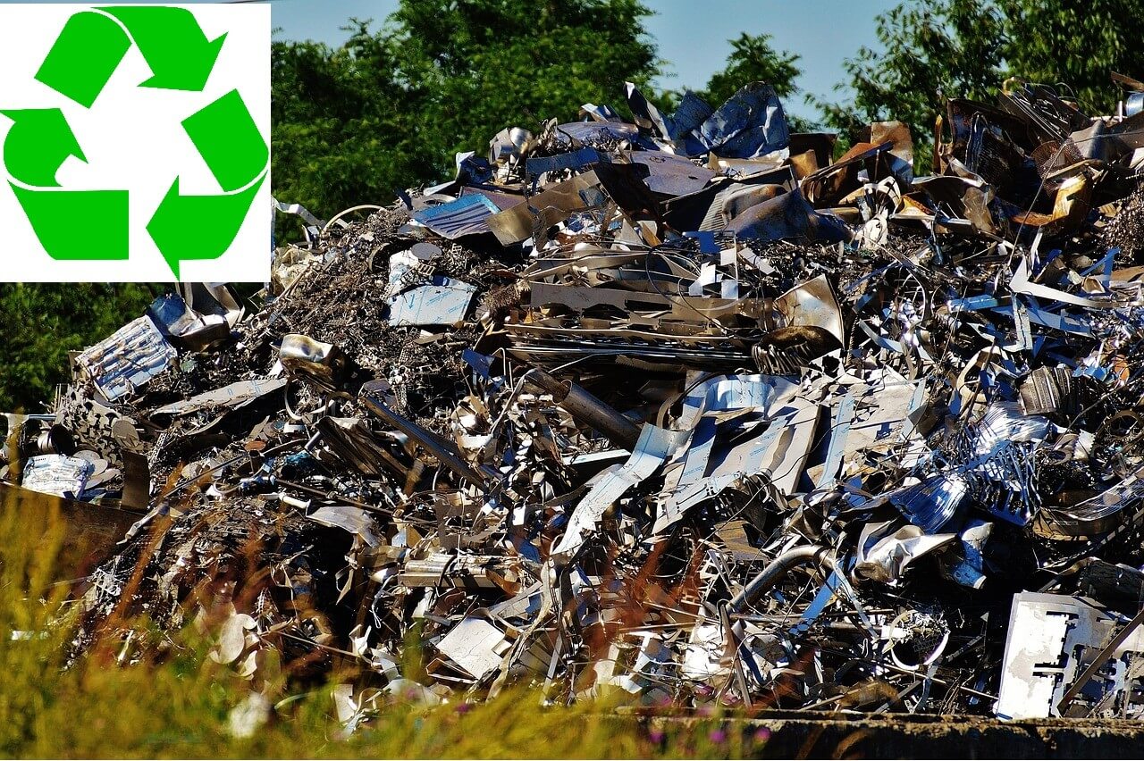 Piles of Old Electronics with Recycling Arrows Overlay